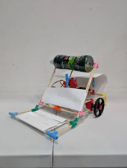 A cart with a soda can on top