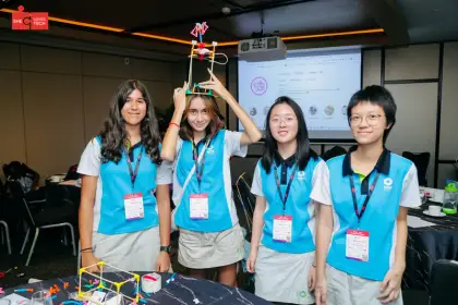 A tower balanced on a head at Girls Love Tech
