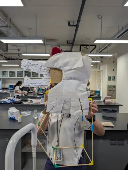 A tall white-wrapped figure