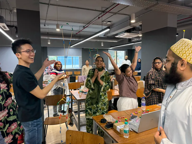 Teachers cheering as their build works