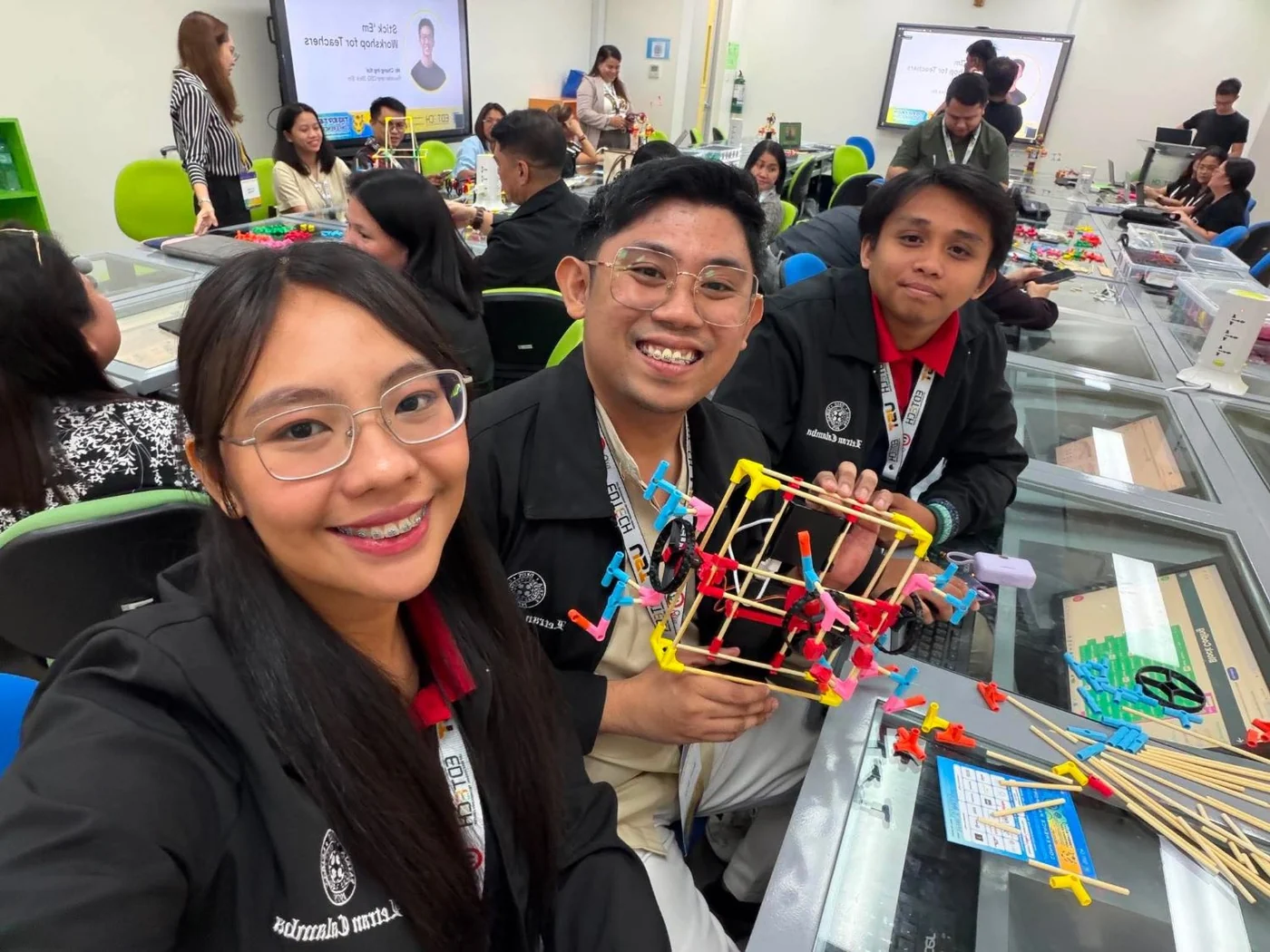 Teachers at a Stick ’Em workshop in the Philippines, building at their tables